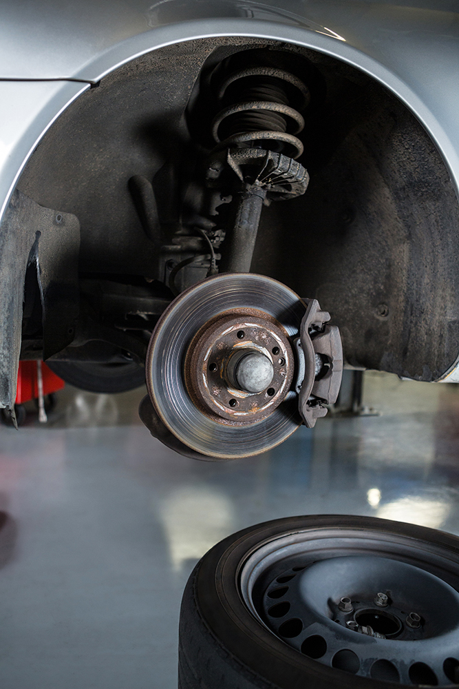 close up of car alignment and suspension service