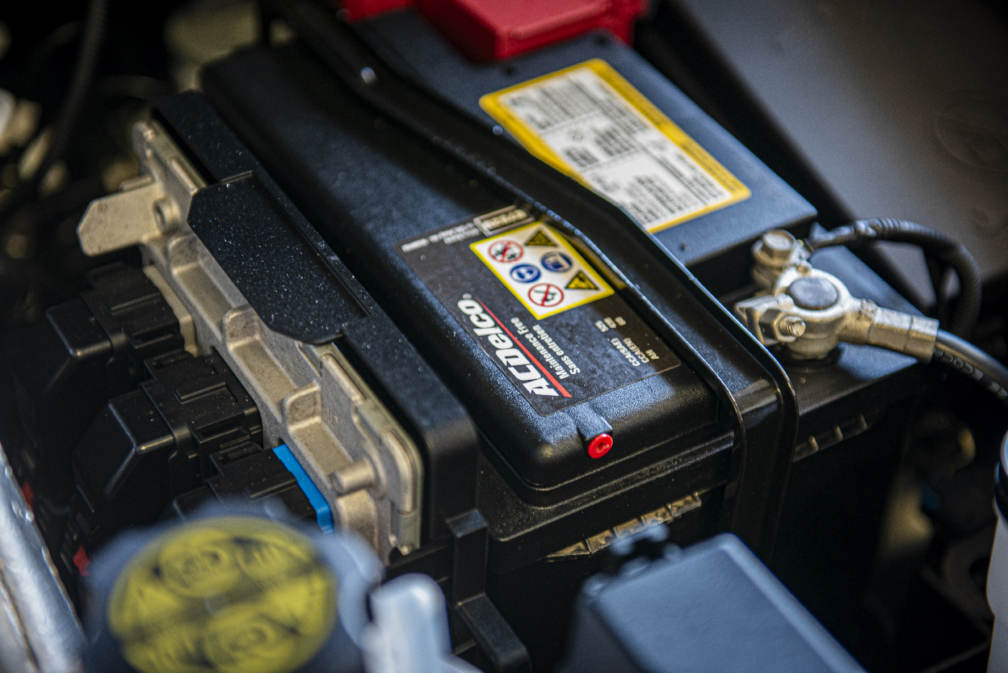 car battery image on a vehicle for car maintenance