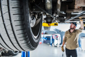 wheel alignment with mechanic in auto repair shop